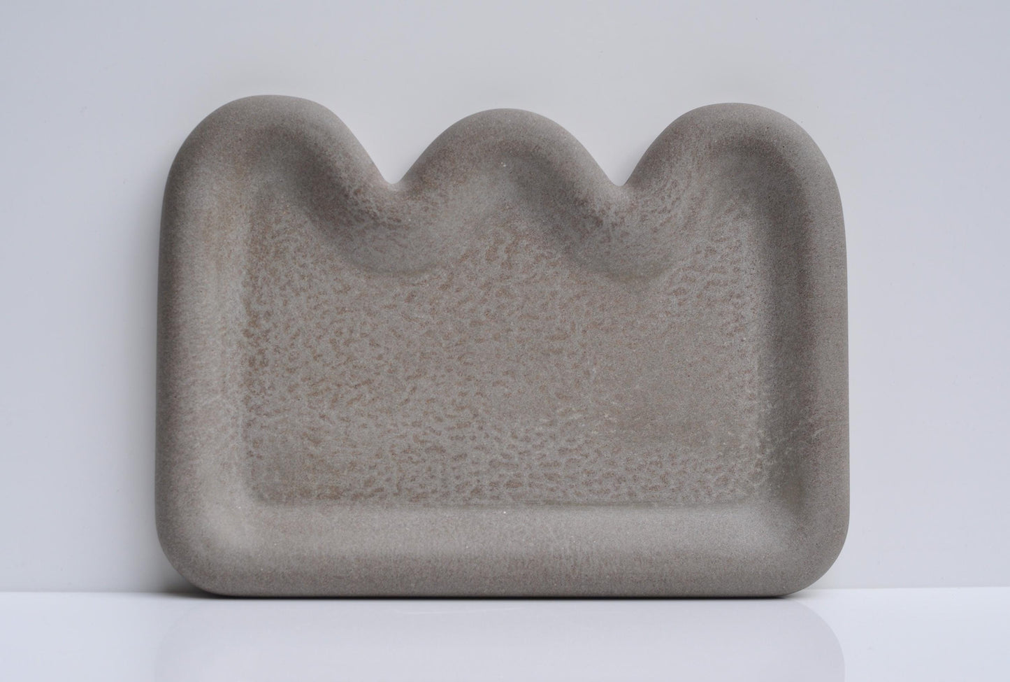 Close-up showing textured grey concrete surface