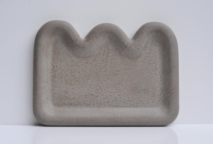 Close-up showing textured grey concrete surface