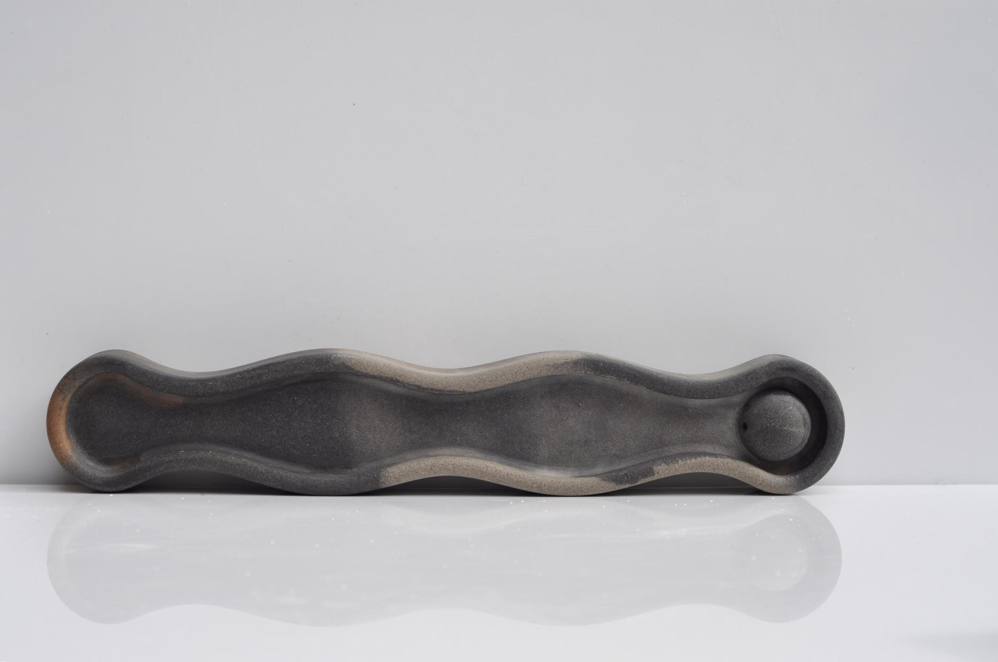 Modern grey incense tray styled in bedroom décor