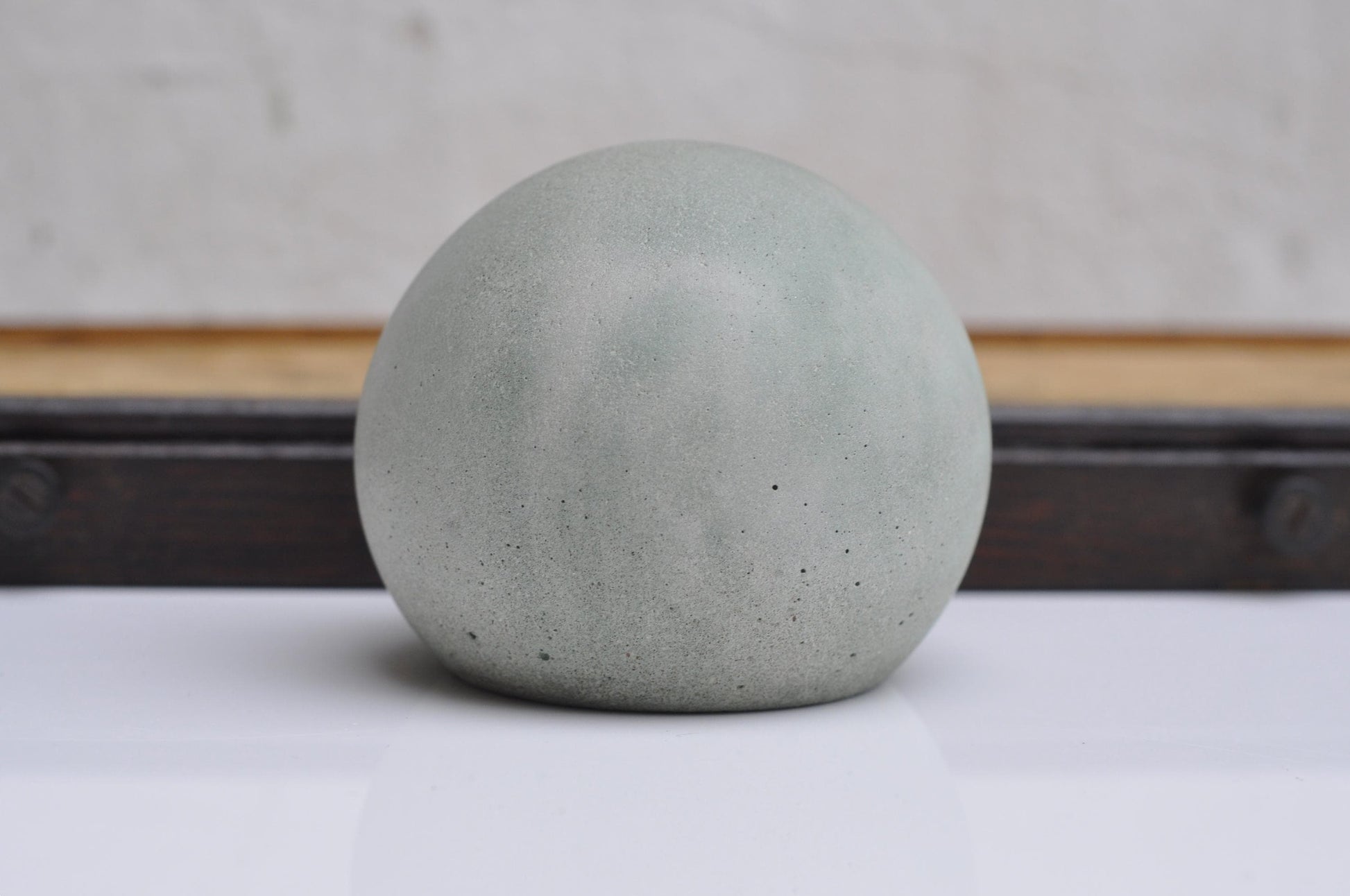 Concrete decorative ball in grey and green