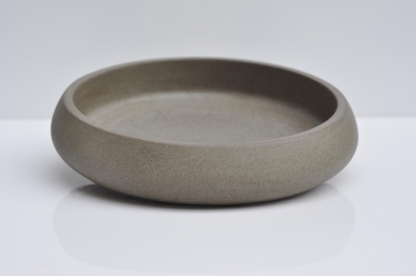 Studio shot of handmade minimalist concrete key bowl