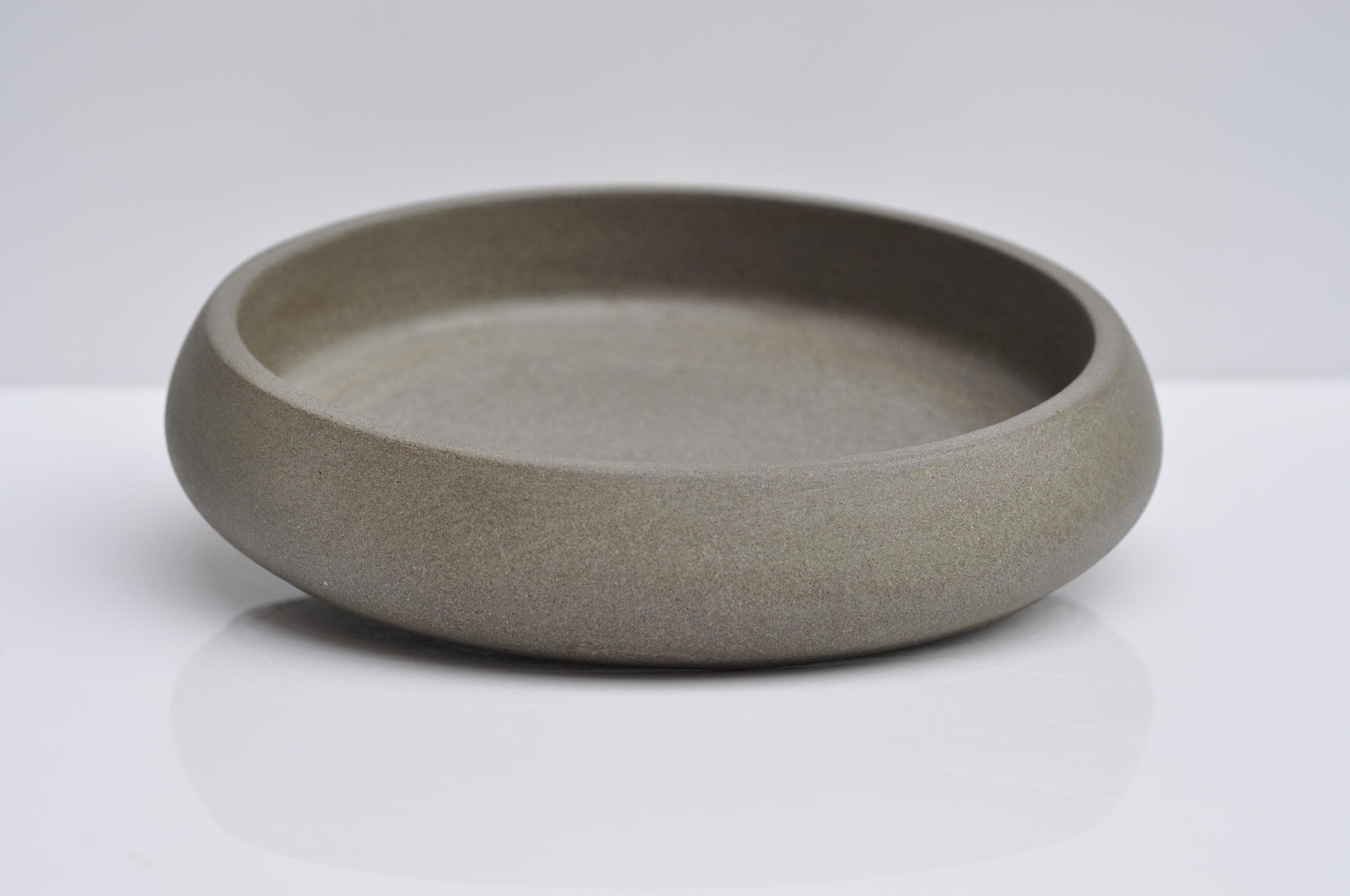 Studio shot of handmade minimalist concrete key bowl