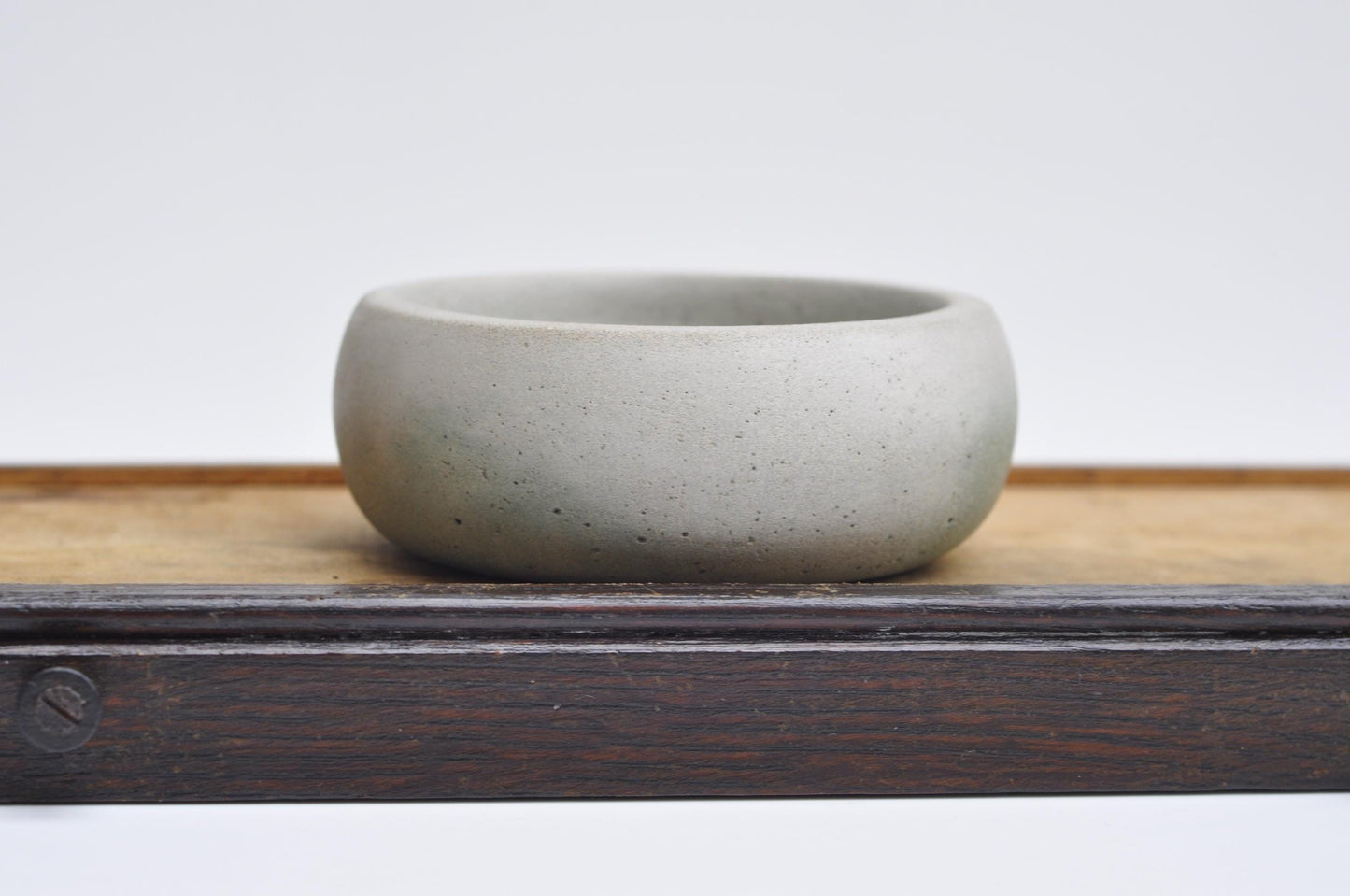Concrete trinket dish with green accent