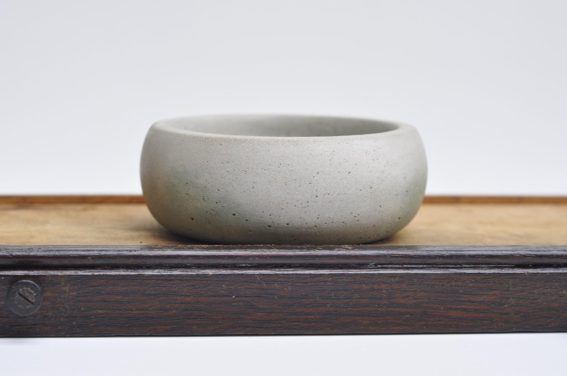 Concrete trinket dish with green accent