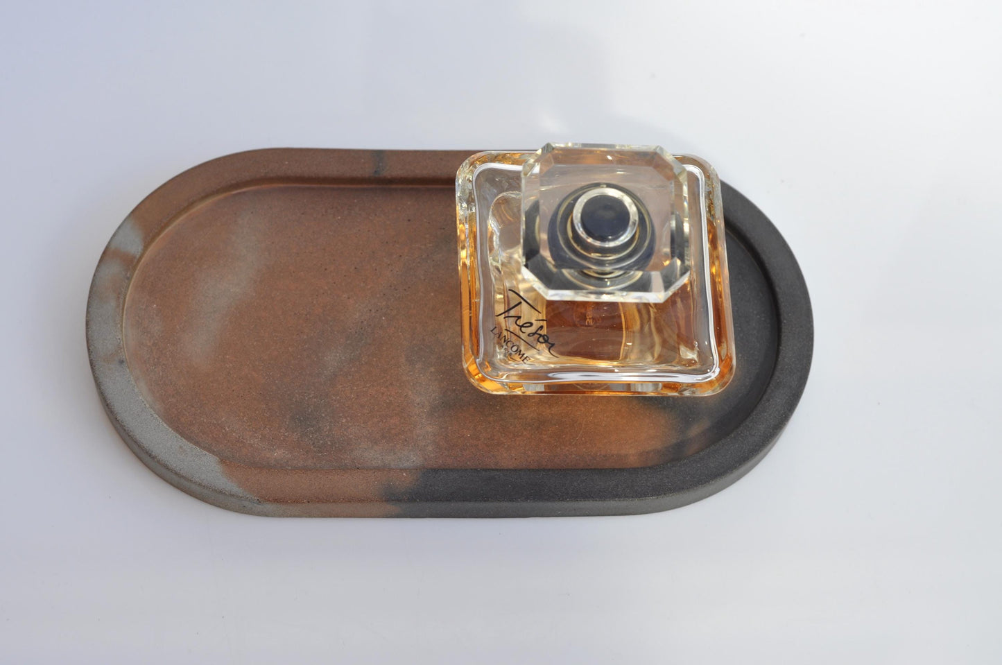 Handmade oval concrete tray with soft textured surface