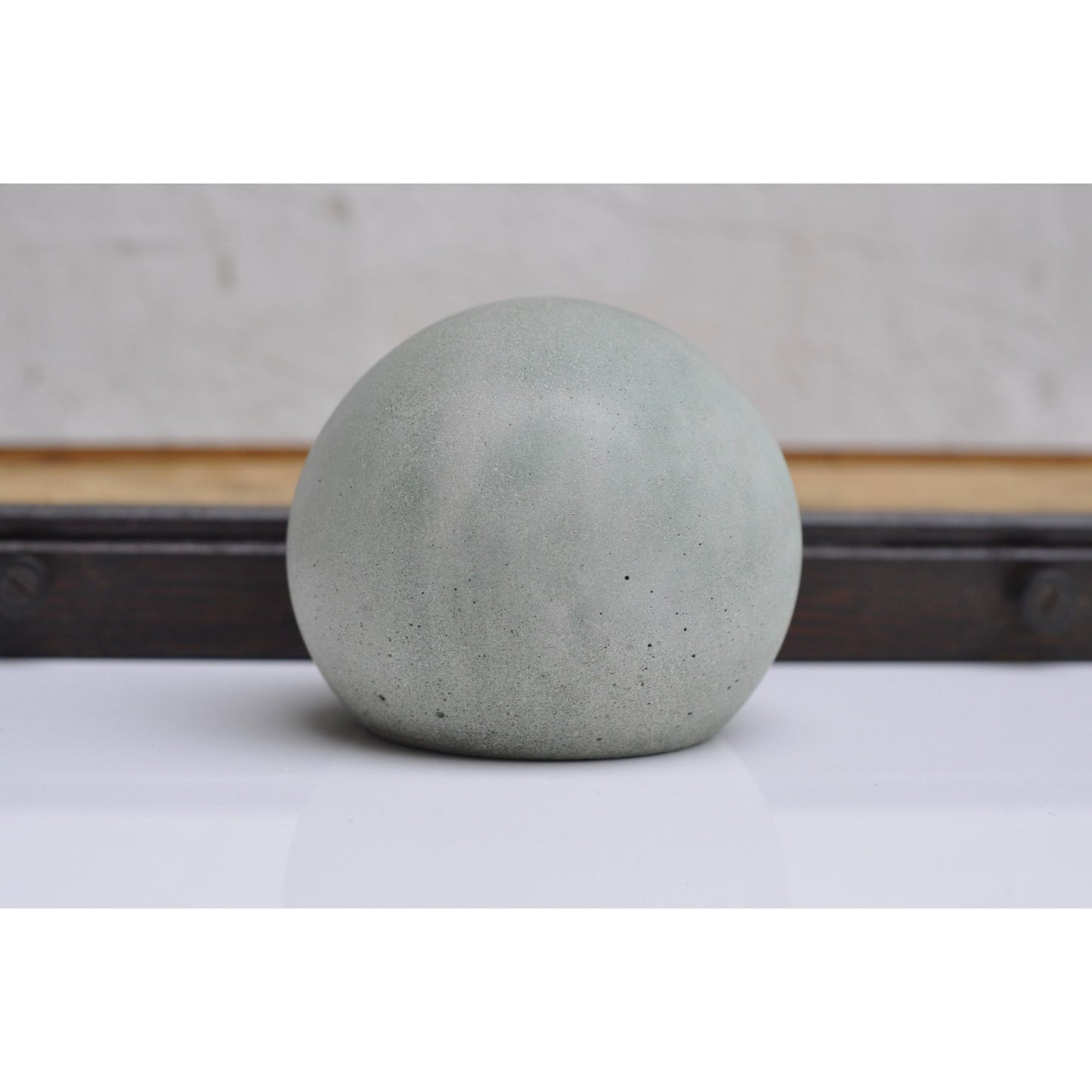 Minimalist concrete paperweight ball