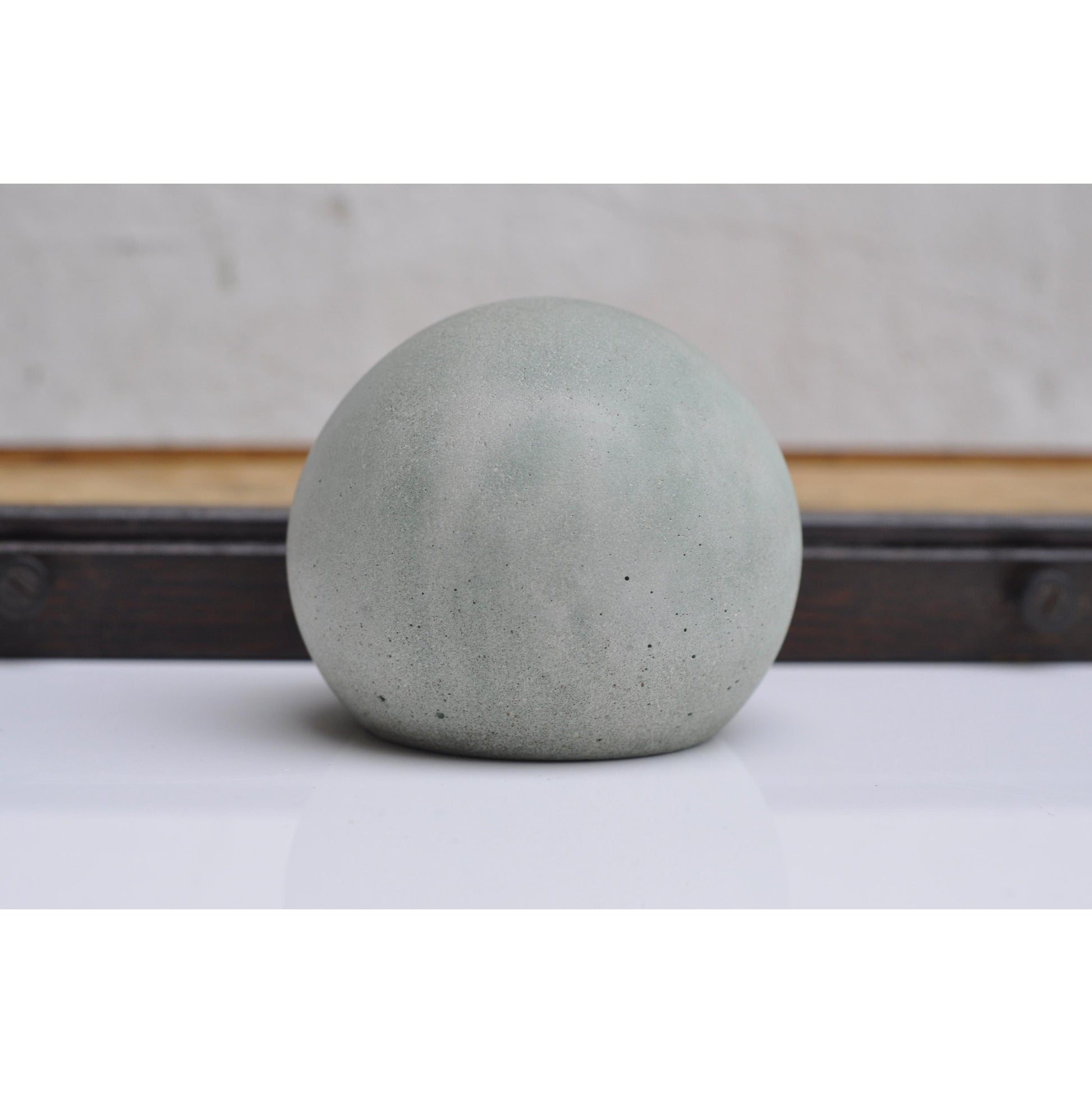 Minimalist concrete paperweight ball