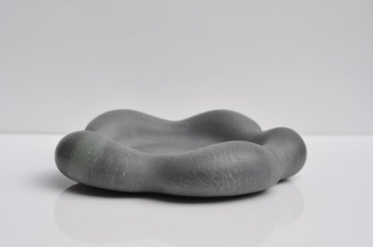 Close-up showing pebble texture of concrete tray