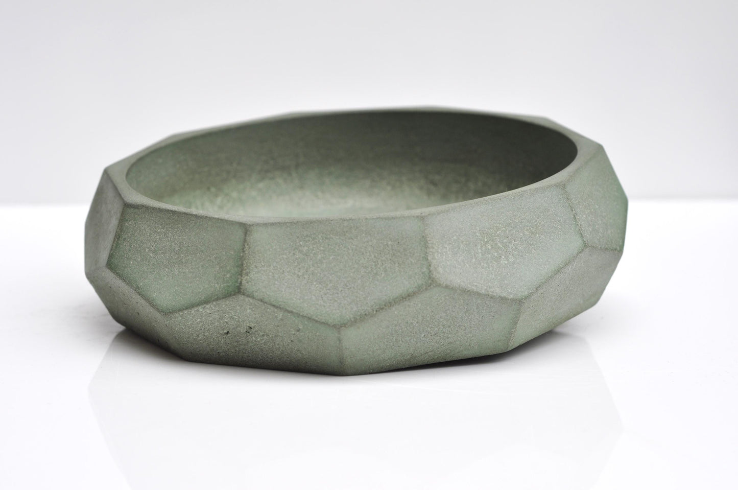 Decorative concrete bowl in muted green-grey