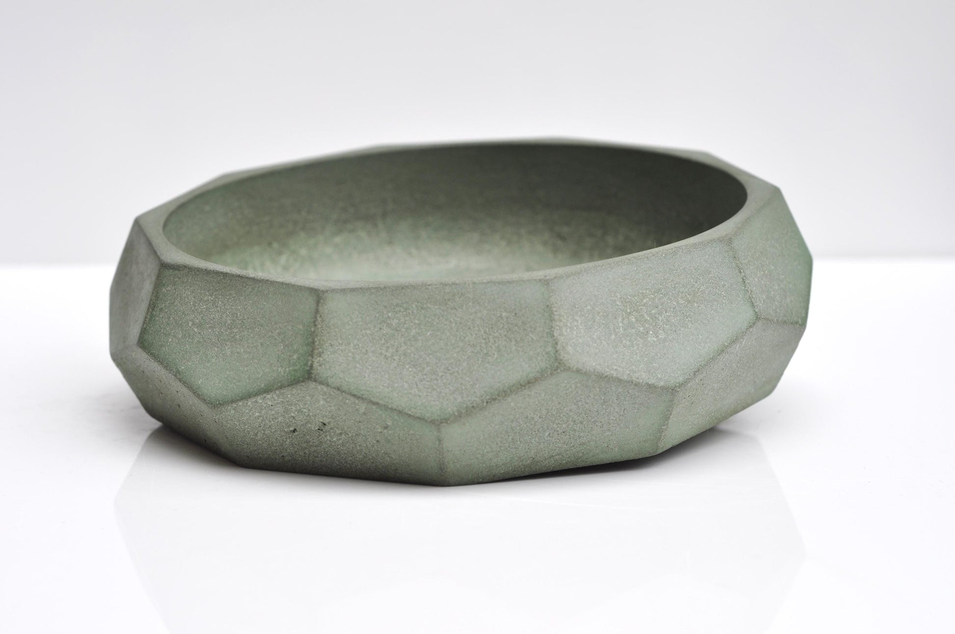 Decorative concrete bowl in muted green-grey