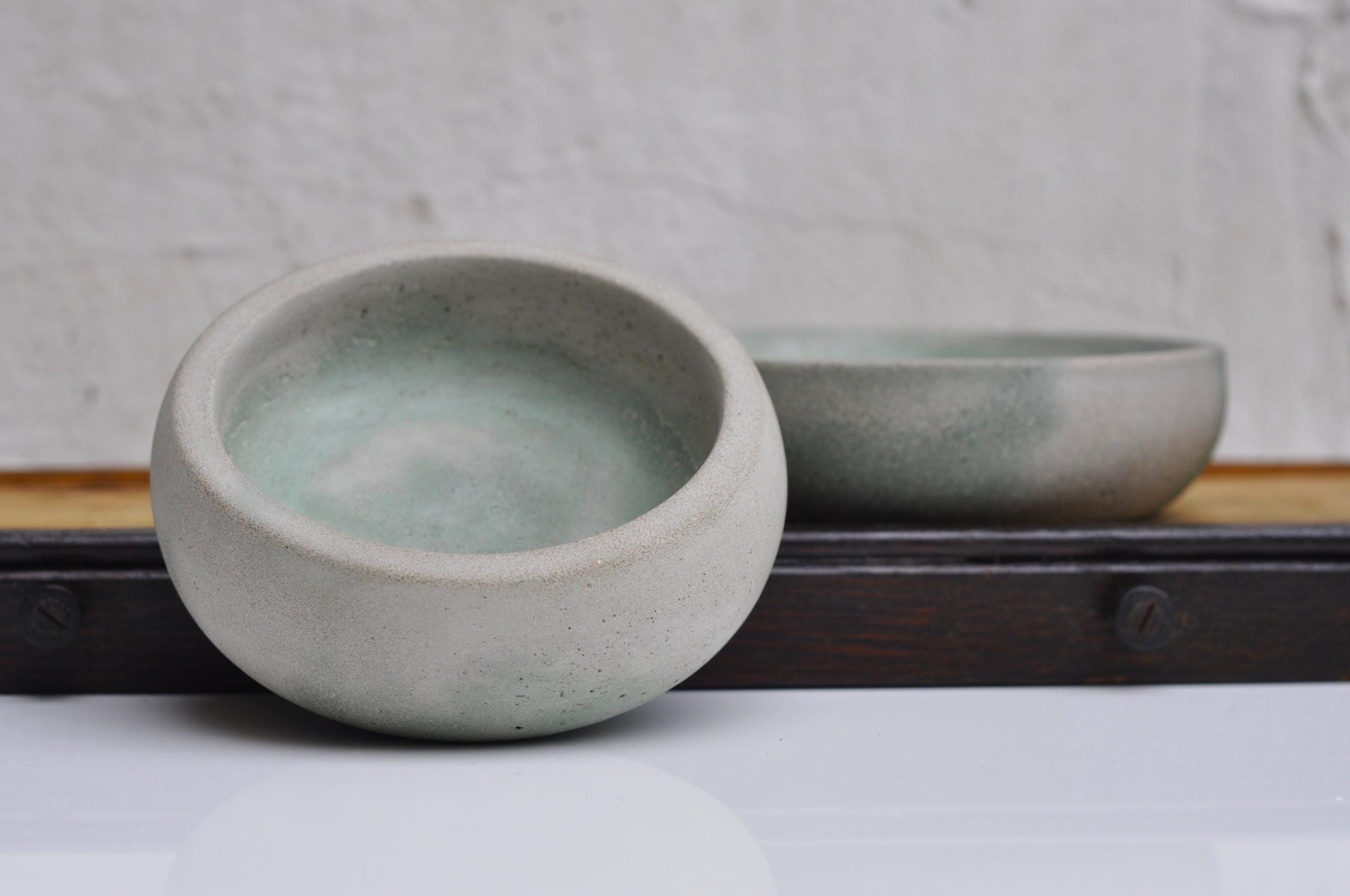 Small rustic concrete coin bowl