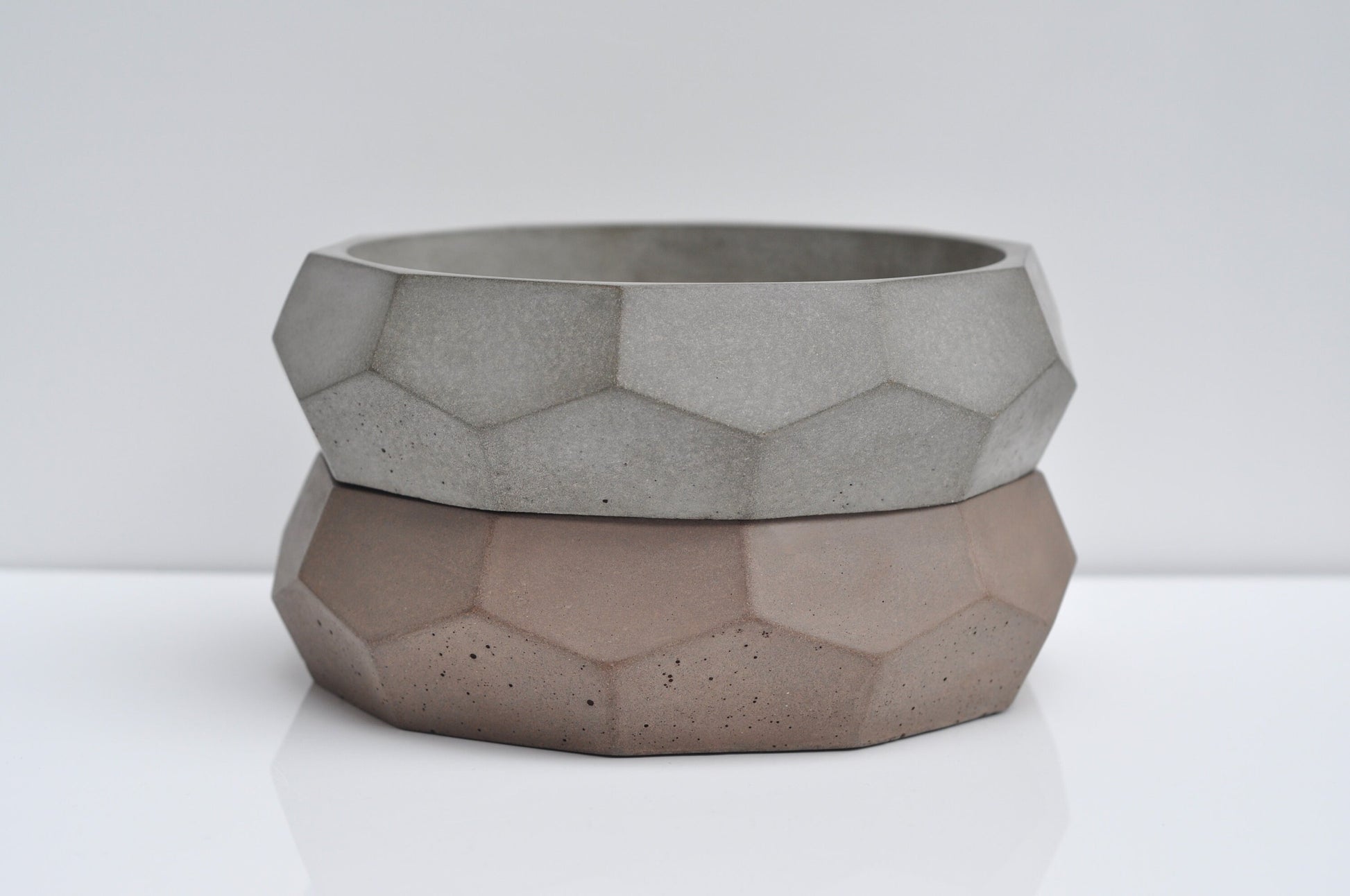 Grey and brown concrete fruit bowls