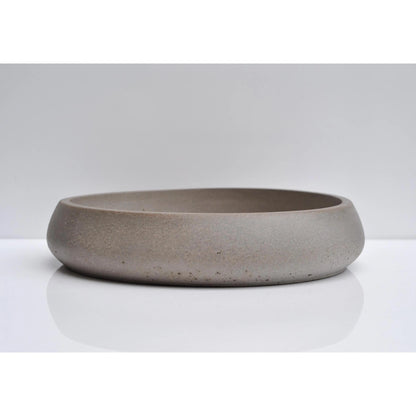 Side view of heavy handmade concrete bowl