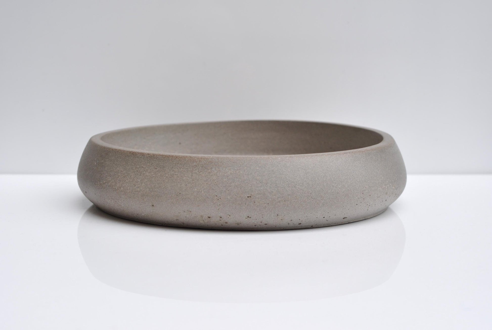 Close-up of concrete texture on handmade fruit bowl