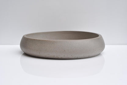 Close-up of concrete texture on handmade fruit bowl