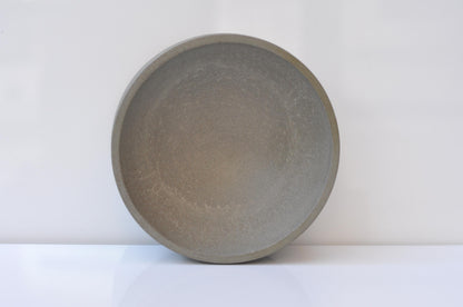 Round concrete bowl on a white background