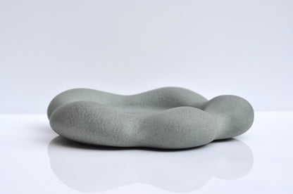 Heavy grey concrete plate with organic flower form