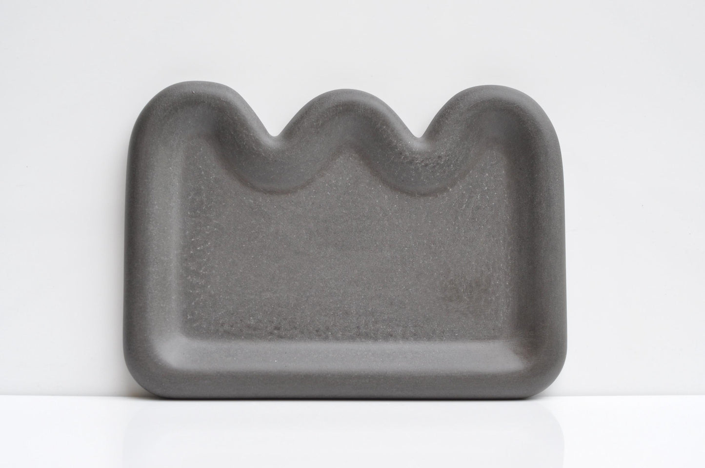 Anthracite concrete dish as functional decorative accent