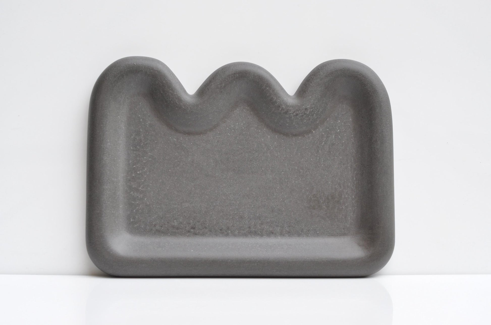 Anthracite concrete dish as functional decorative accent