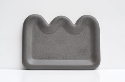 Anthracite concrete dish as functional decorative accent
