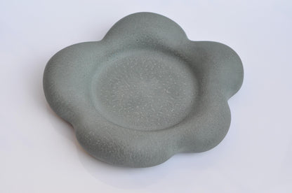 Heavy grey concrete plate with organic flower form