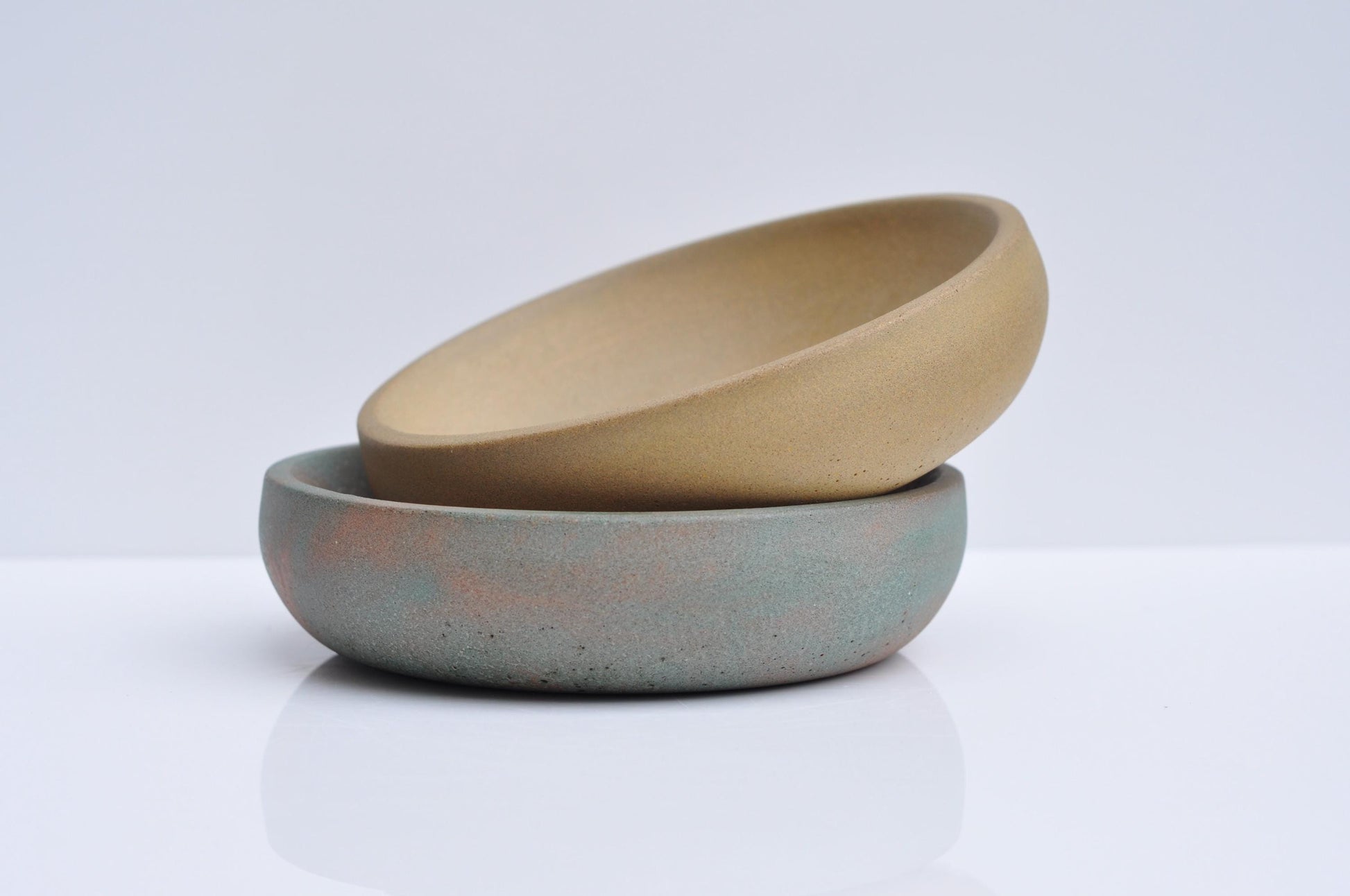  Minimalist ochre concrete bowl styled on shelf