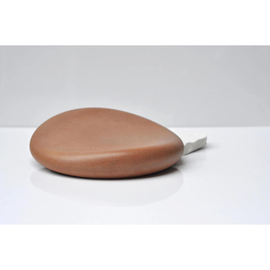 Handmade orange concrete pebble tray with organic shape