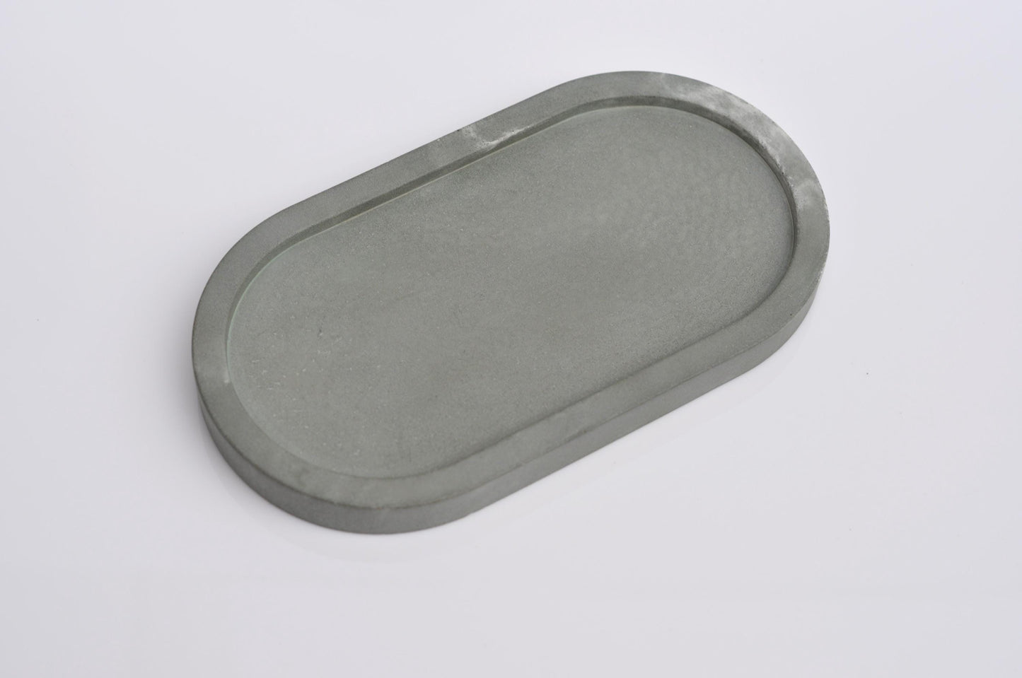 Studio shot of handmade green concrete tray