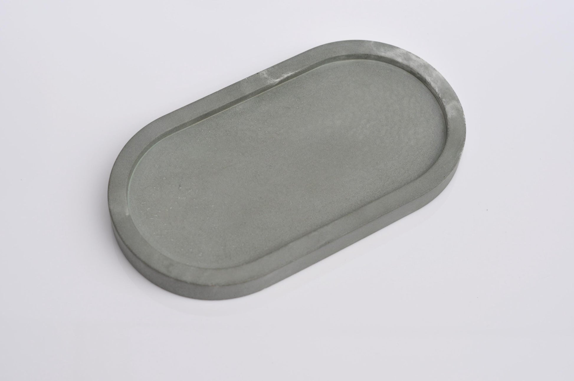 Studio shot of handmade green concrete tray