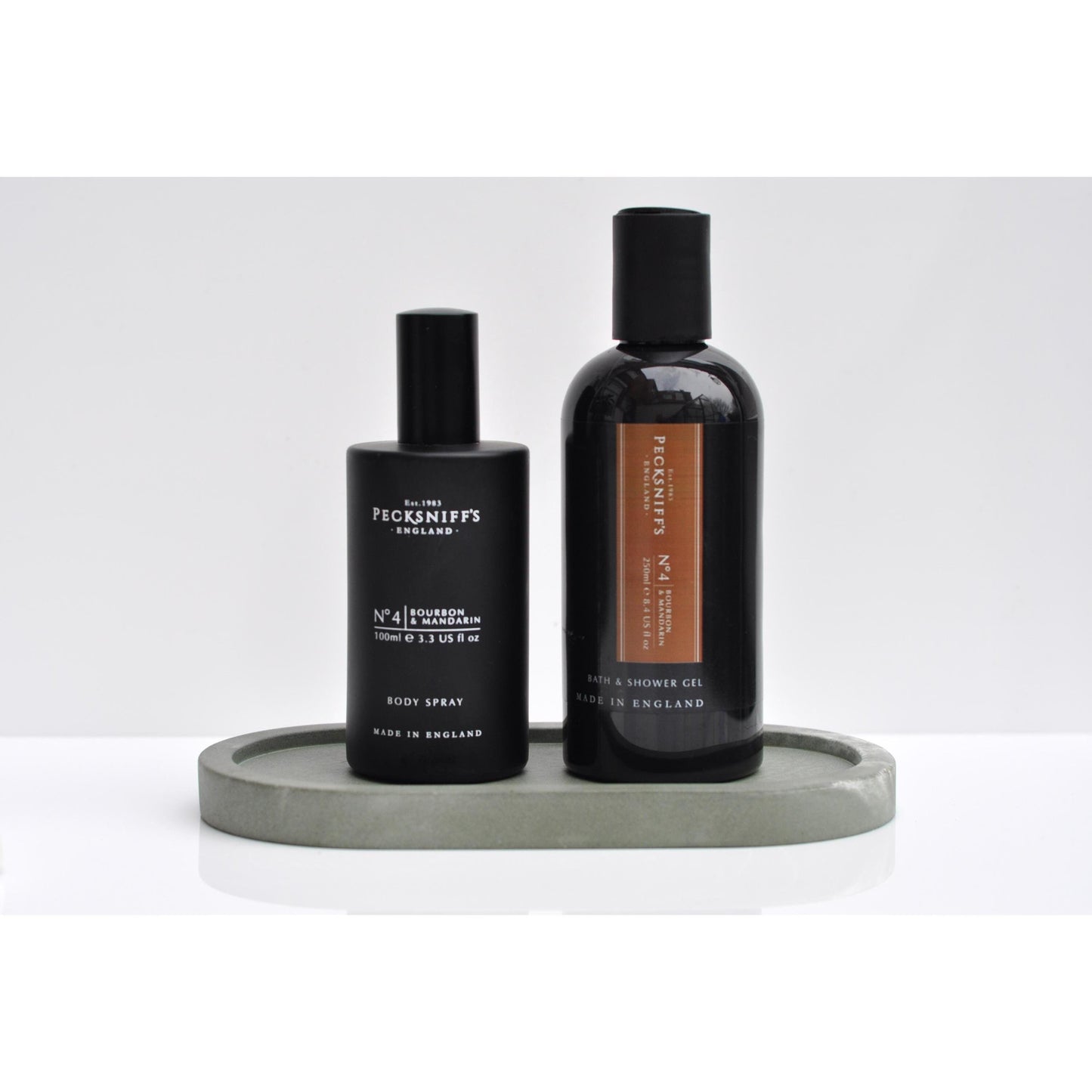 Side angle of green oval concrete tray on table