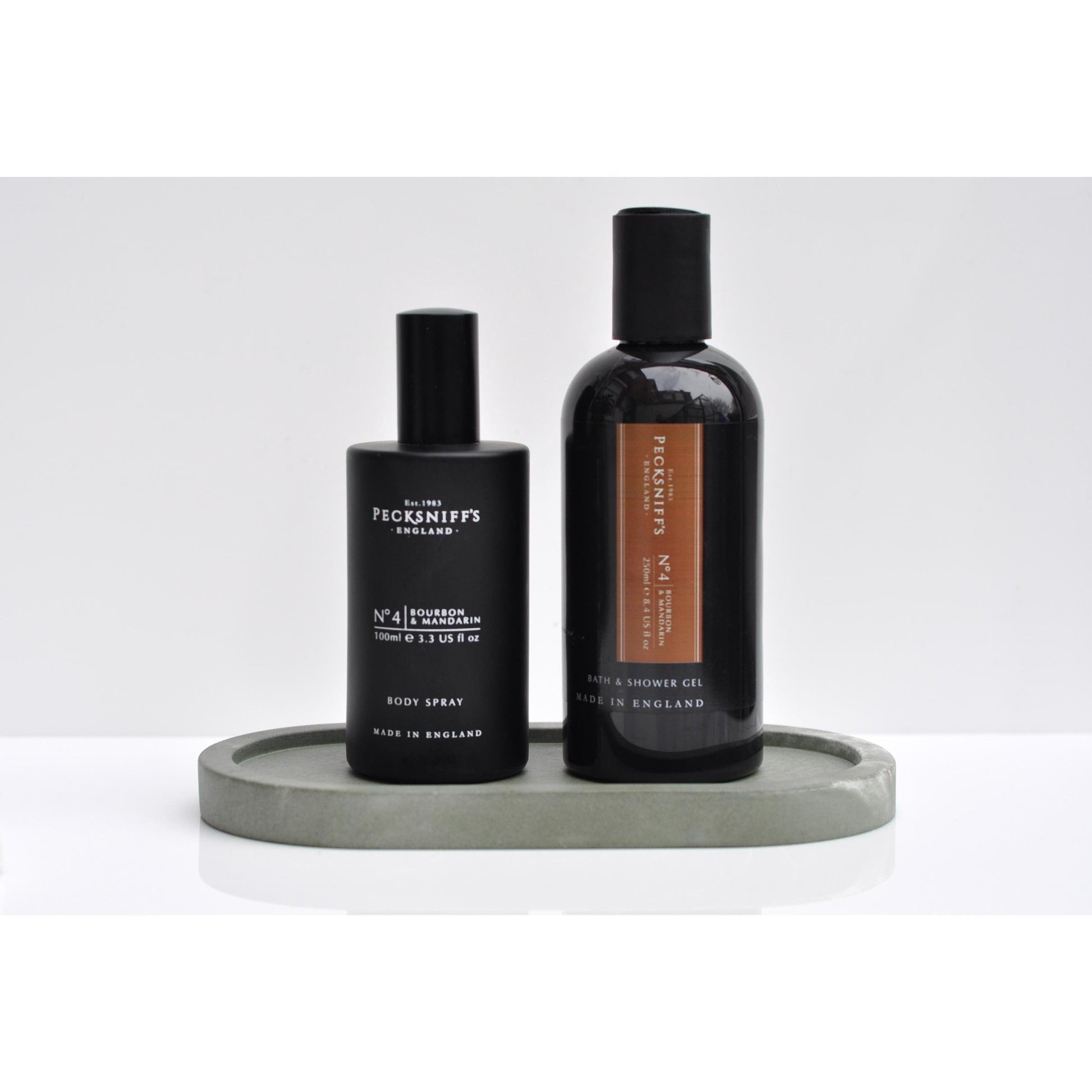 Side angle of green oval concrete tray on table