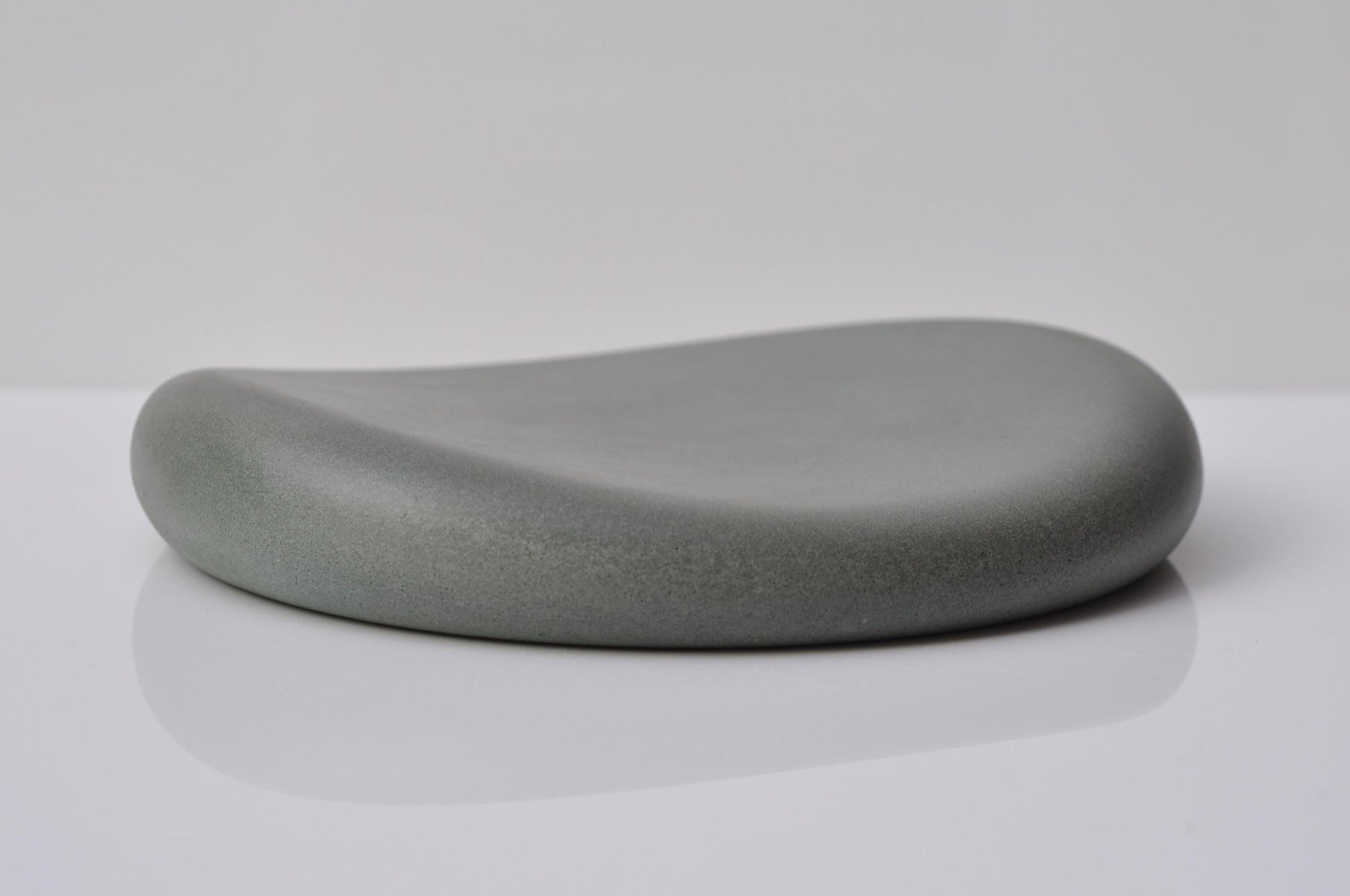 Gray stone-like object on a white background