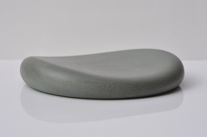 Gray stone-like object on a white background
