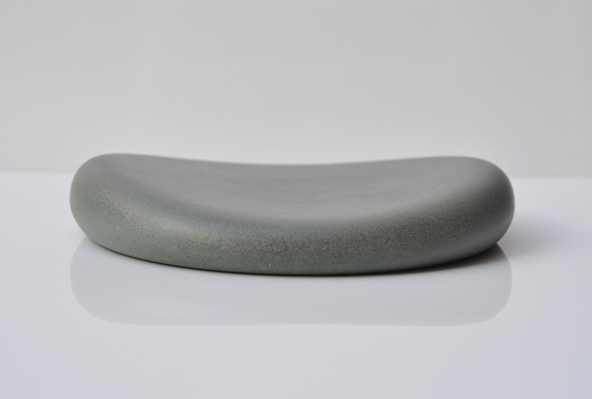 Studio shot of handmade grey and green concrete tray