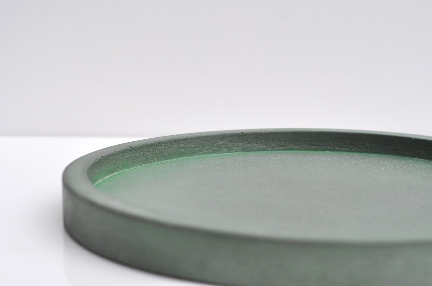 Green cement  dish on a white background
