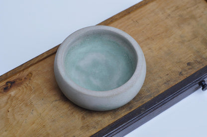 Rustic coin and key bowl made from concrete