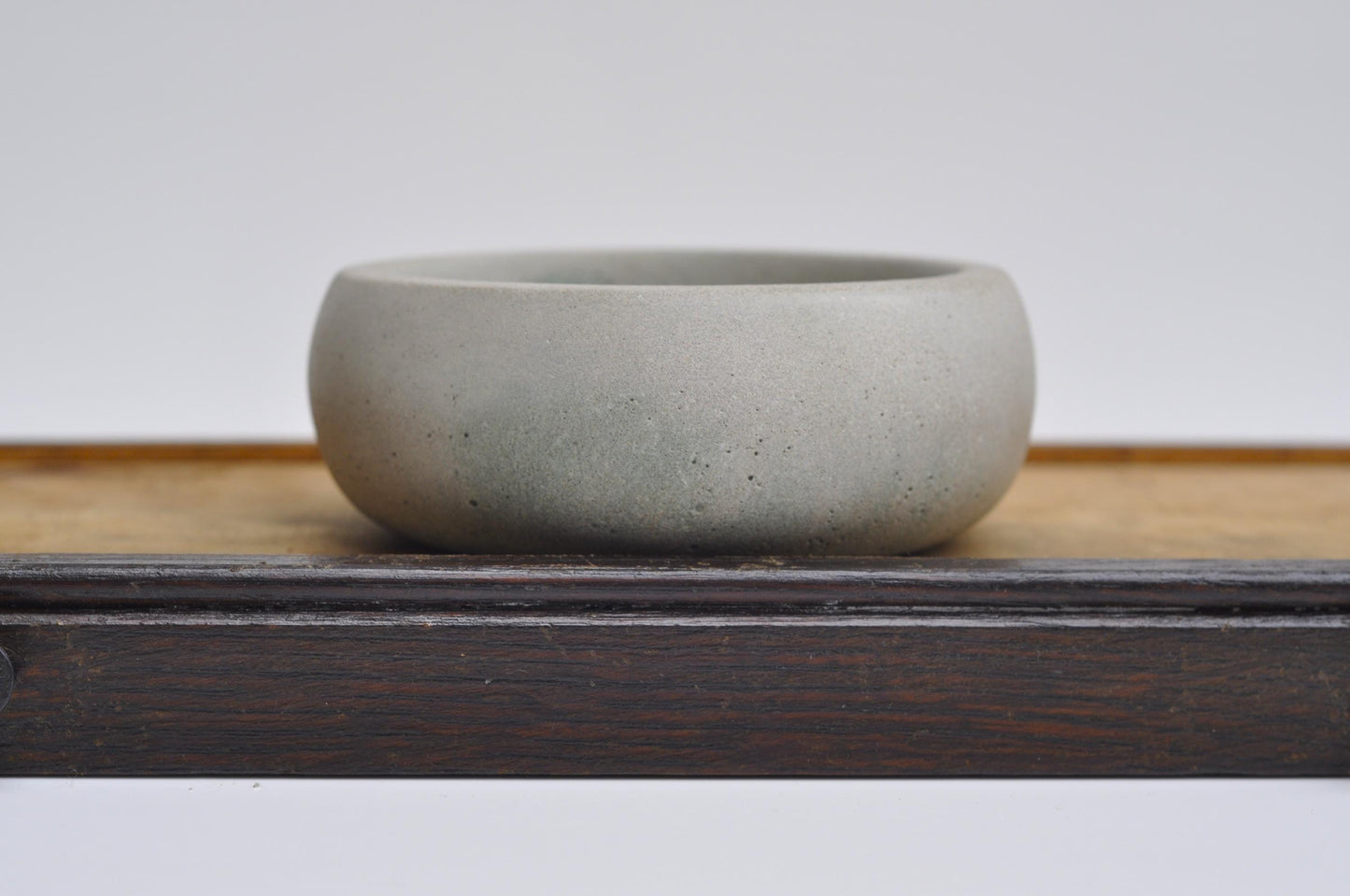 Light grey rustic concrete bowl for coins
