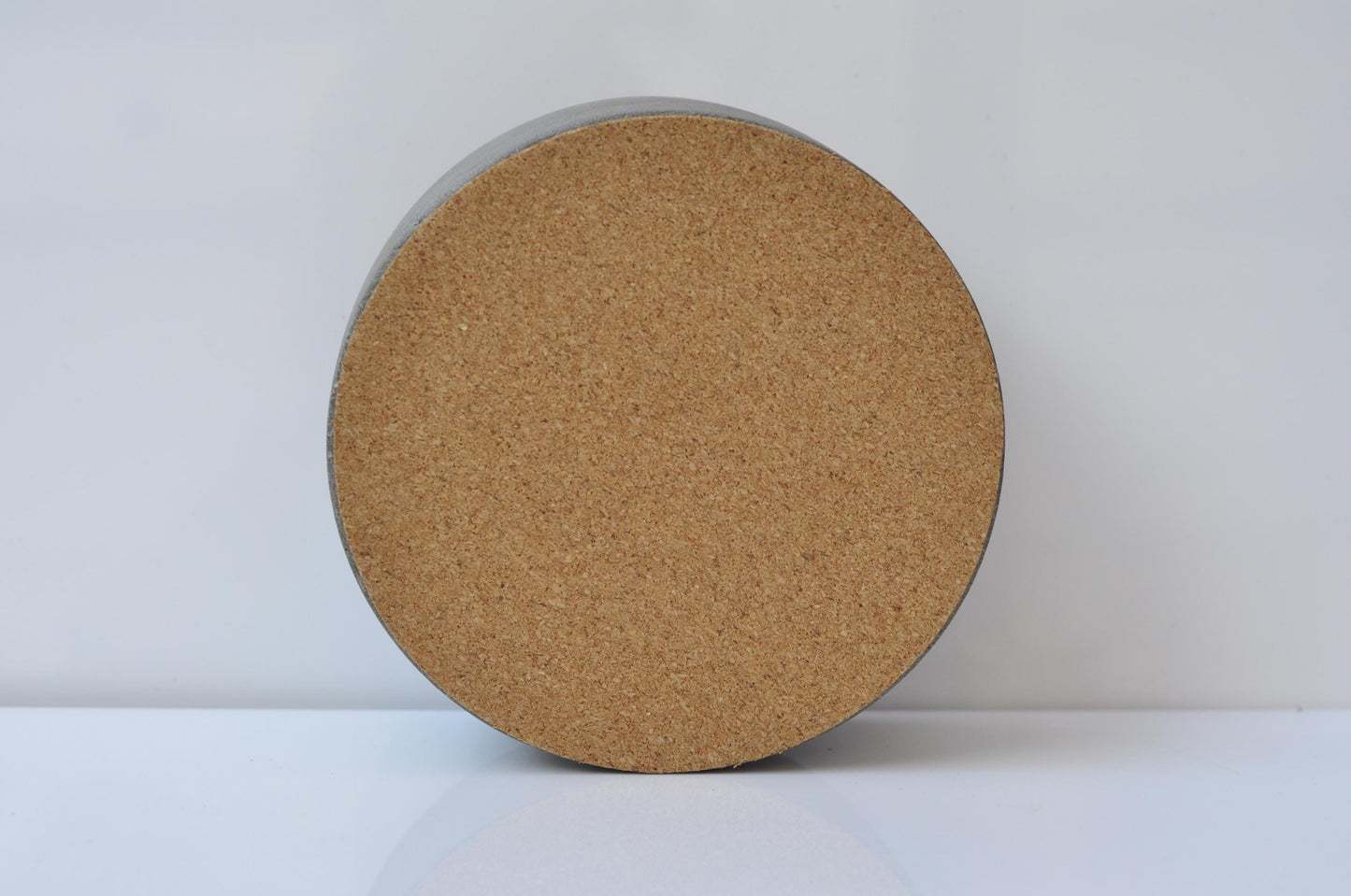 Round cork base on a white background
