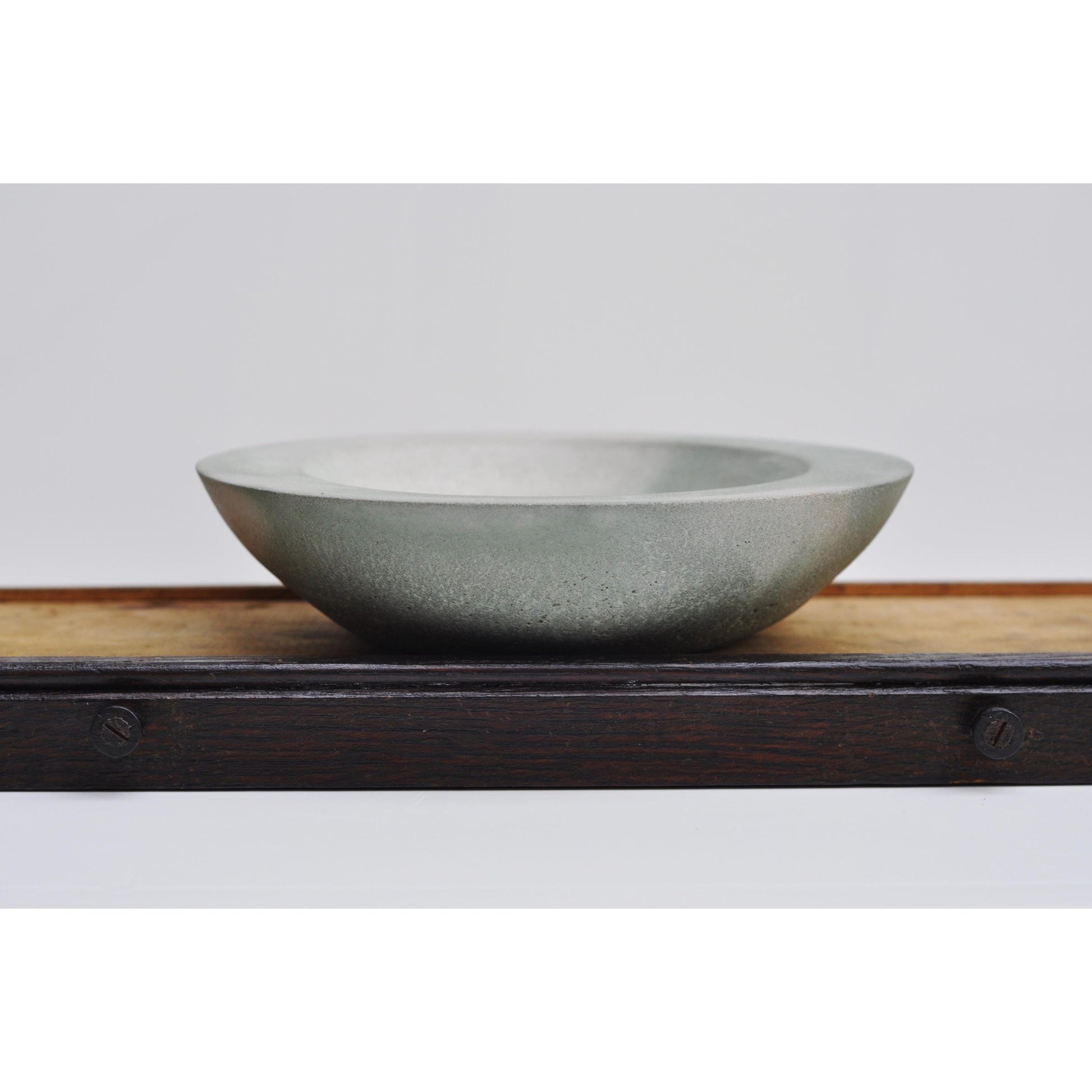Shallow concrete bowl in light grey and green