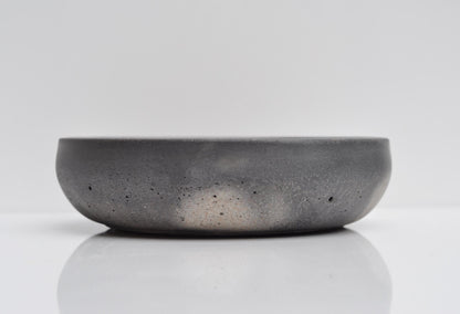 Studio shot of small handmade grey concrete bowl