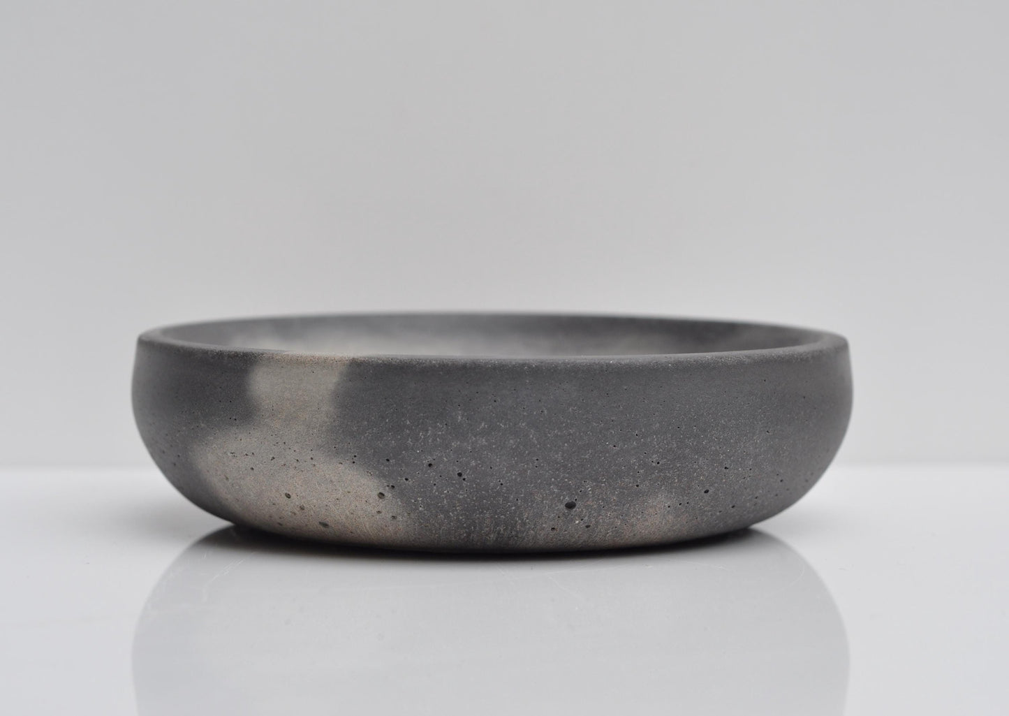 Small concrete bowl in modern home setting