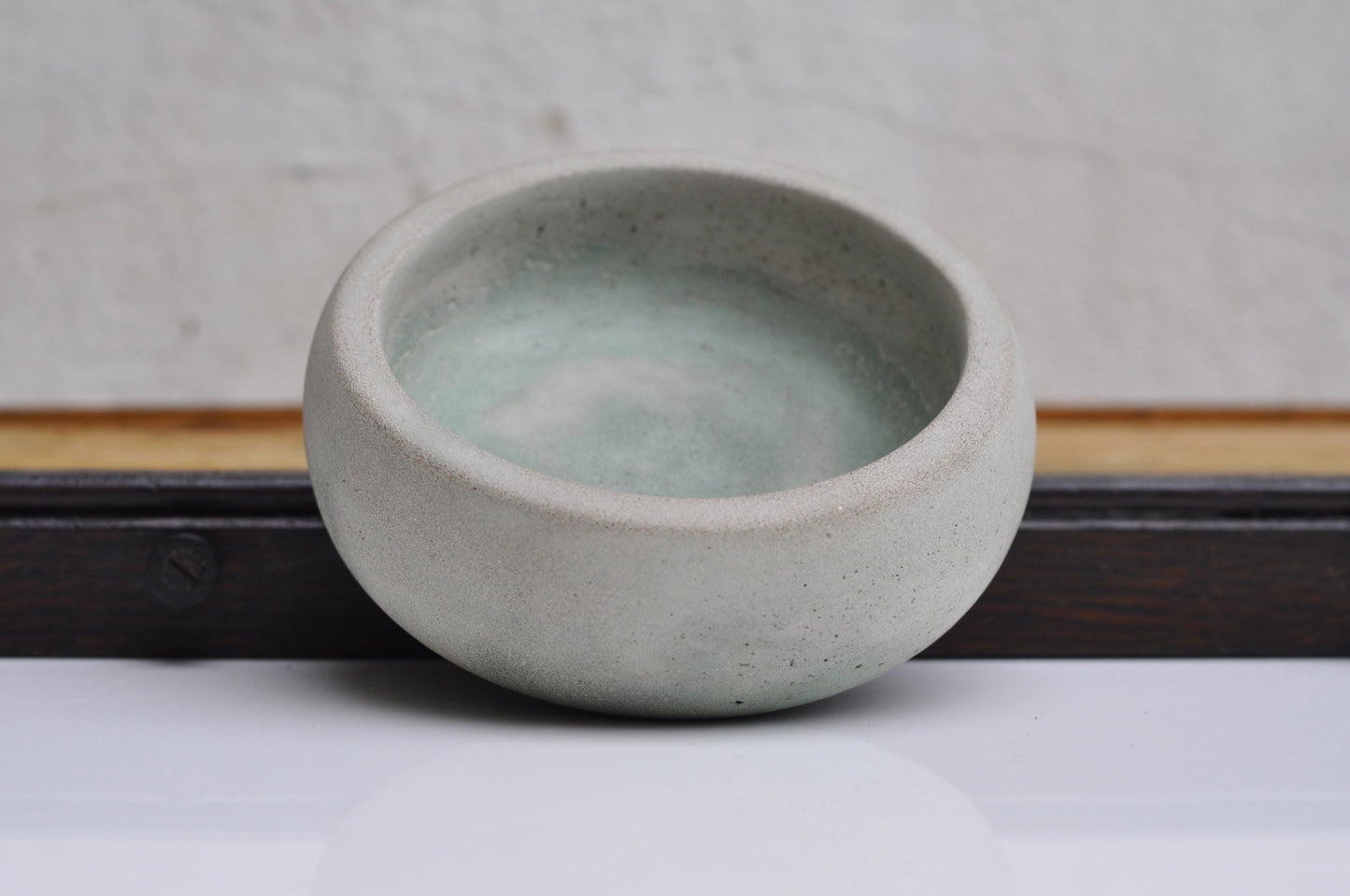 Light grey and green cement jewellery dish