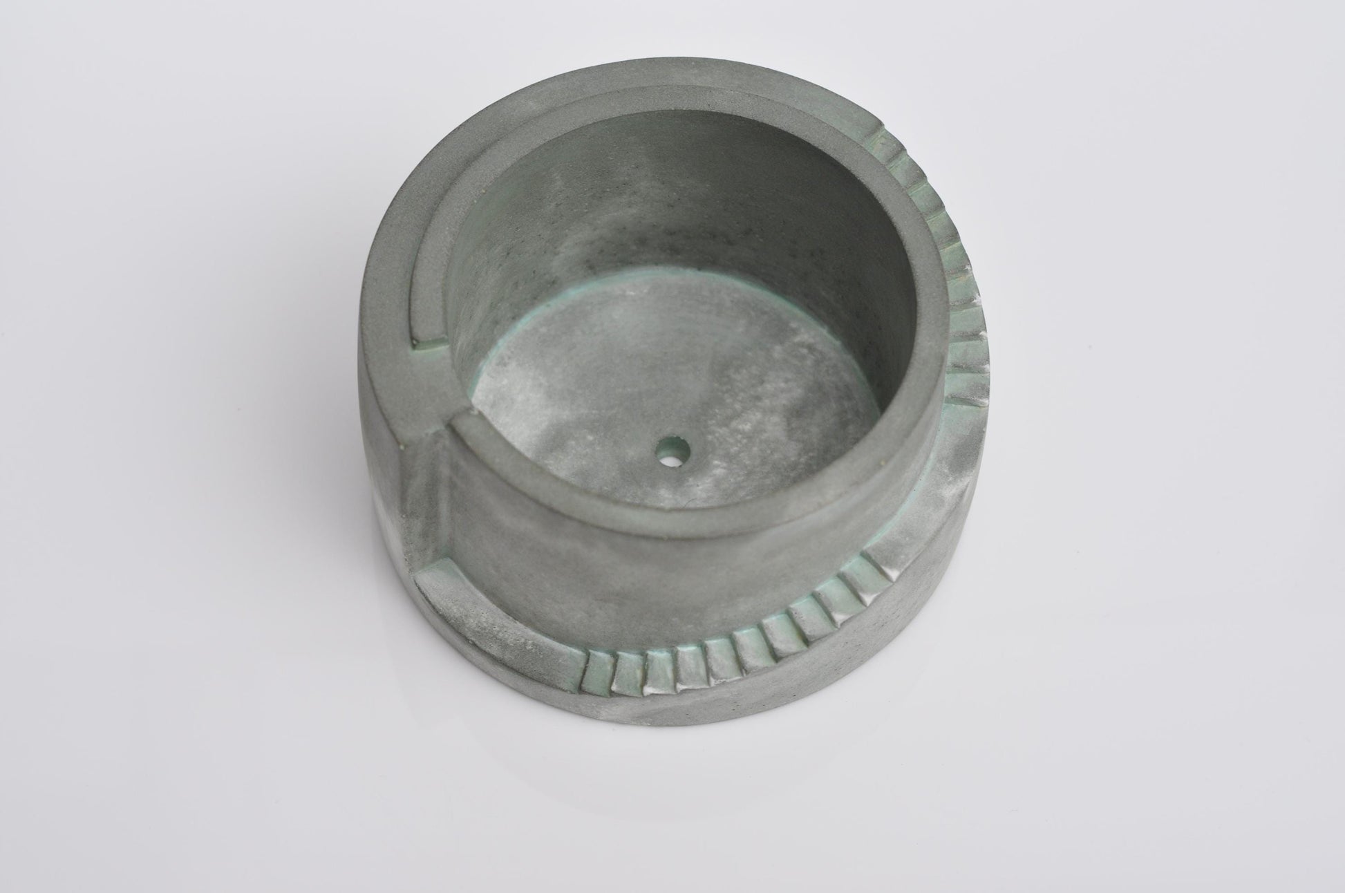 Close-up showing textured surface of concrete planter