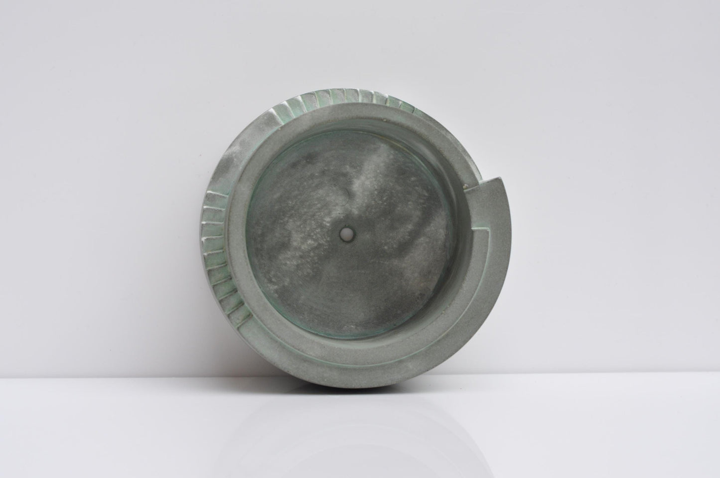 Studio shot of handmade grey concrete planter