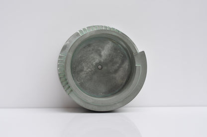 Studio shot of handmade grey concrete planter