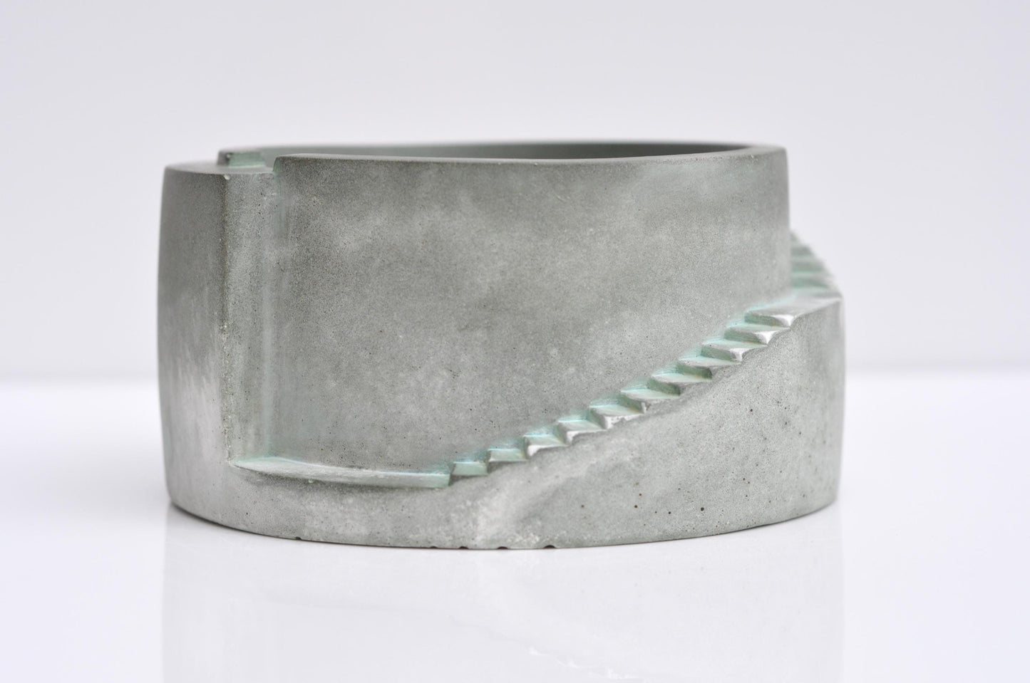 Concrete planter with geometric design on a white background