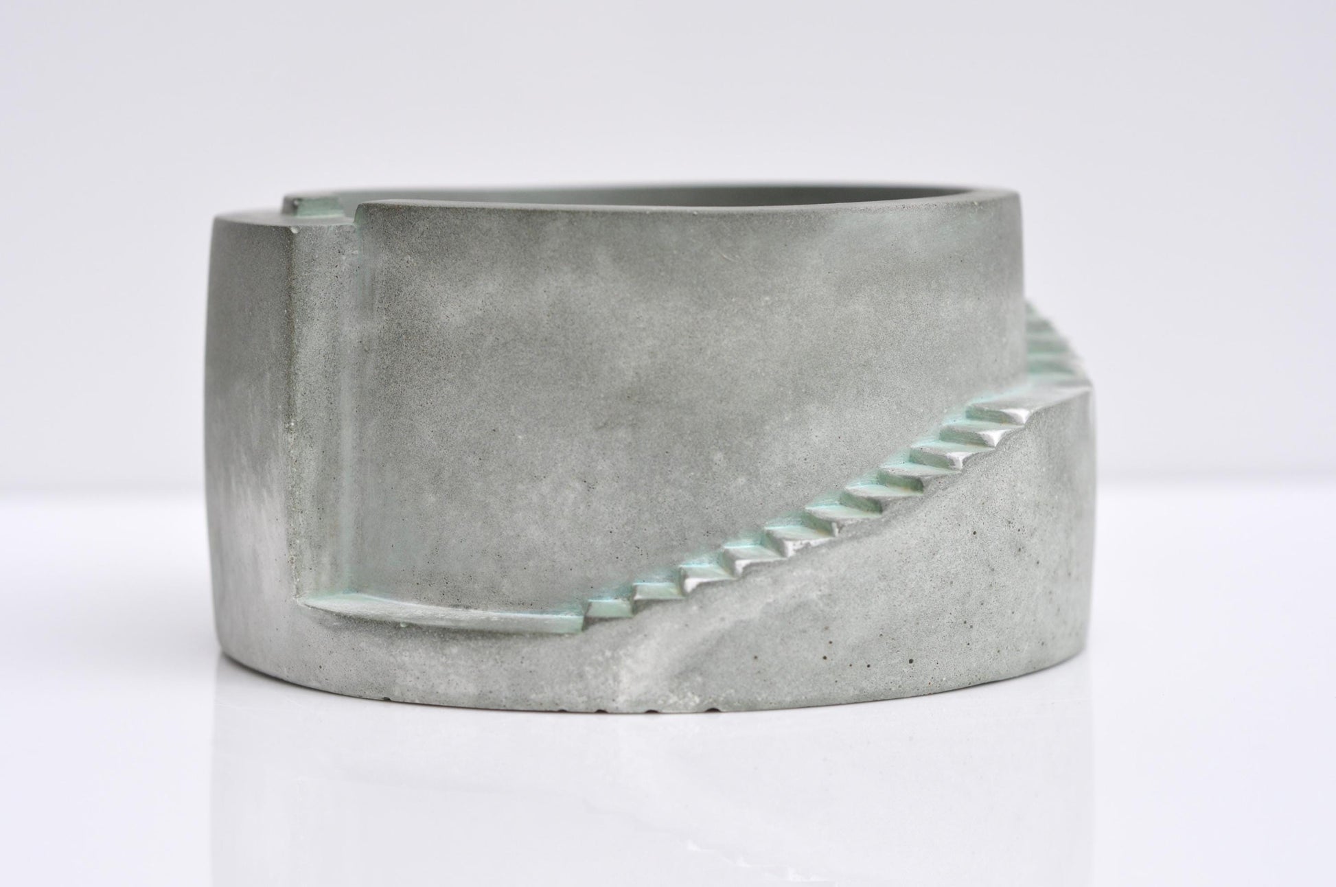 Concrete planter with geometric design on a white background