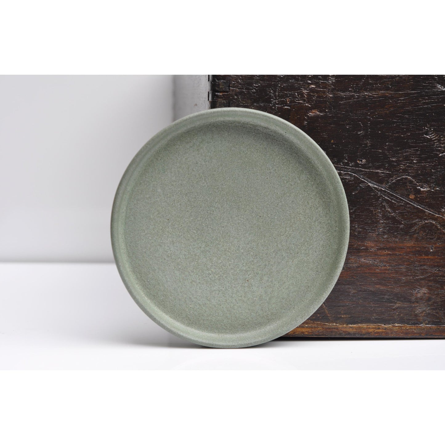 Small round ash green concrete tray