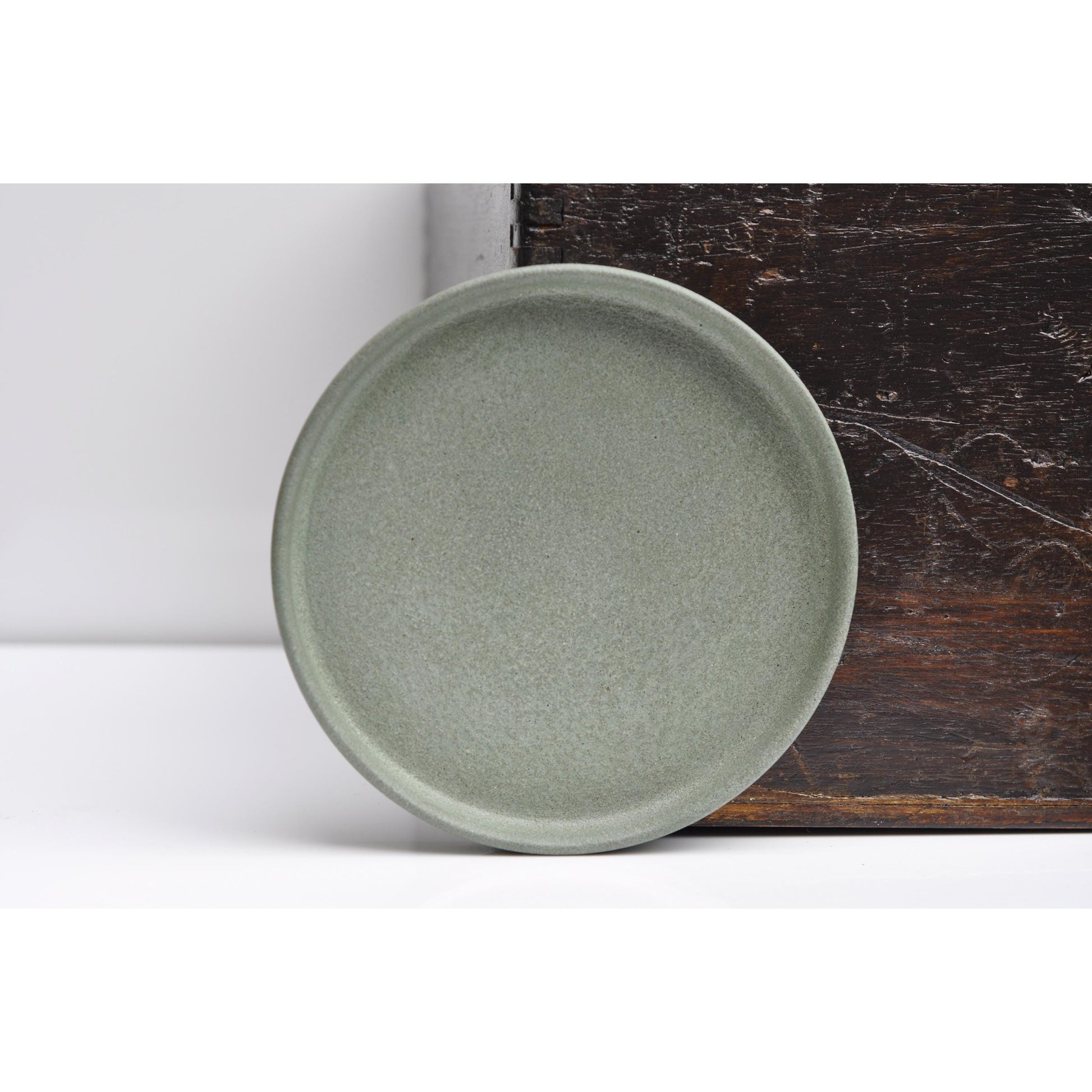 Small round ash green concrete tray