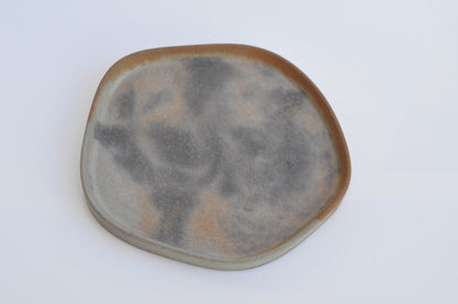 Irregular shaped tray used for candles and accessories